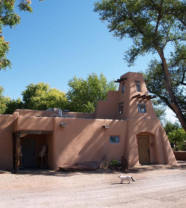 An image of a clay style home built in Corrales, New Mexico.