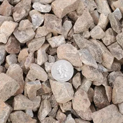 Amaretto 1 inch decorative gravel stones, including shades of red, white, and gray, ideal for enhancing landscape designs and adding visual appeal.